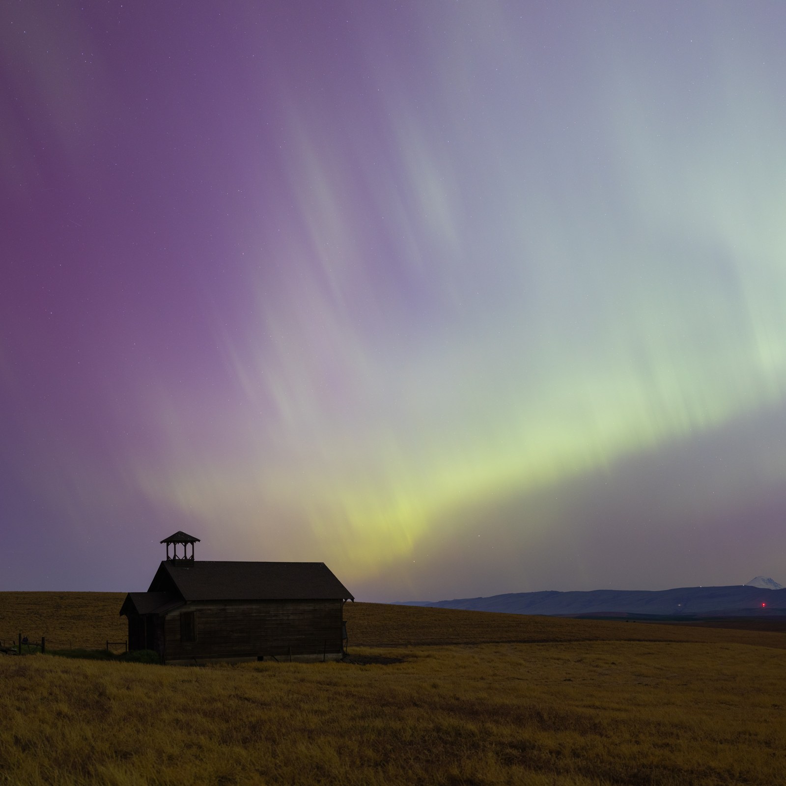 Northern lights over schoolhouse portrait