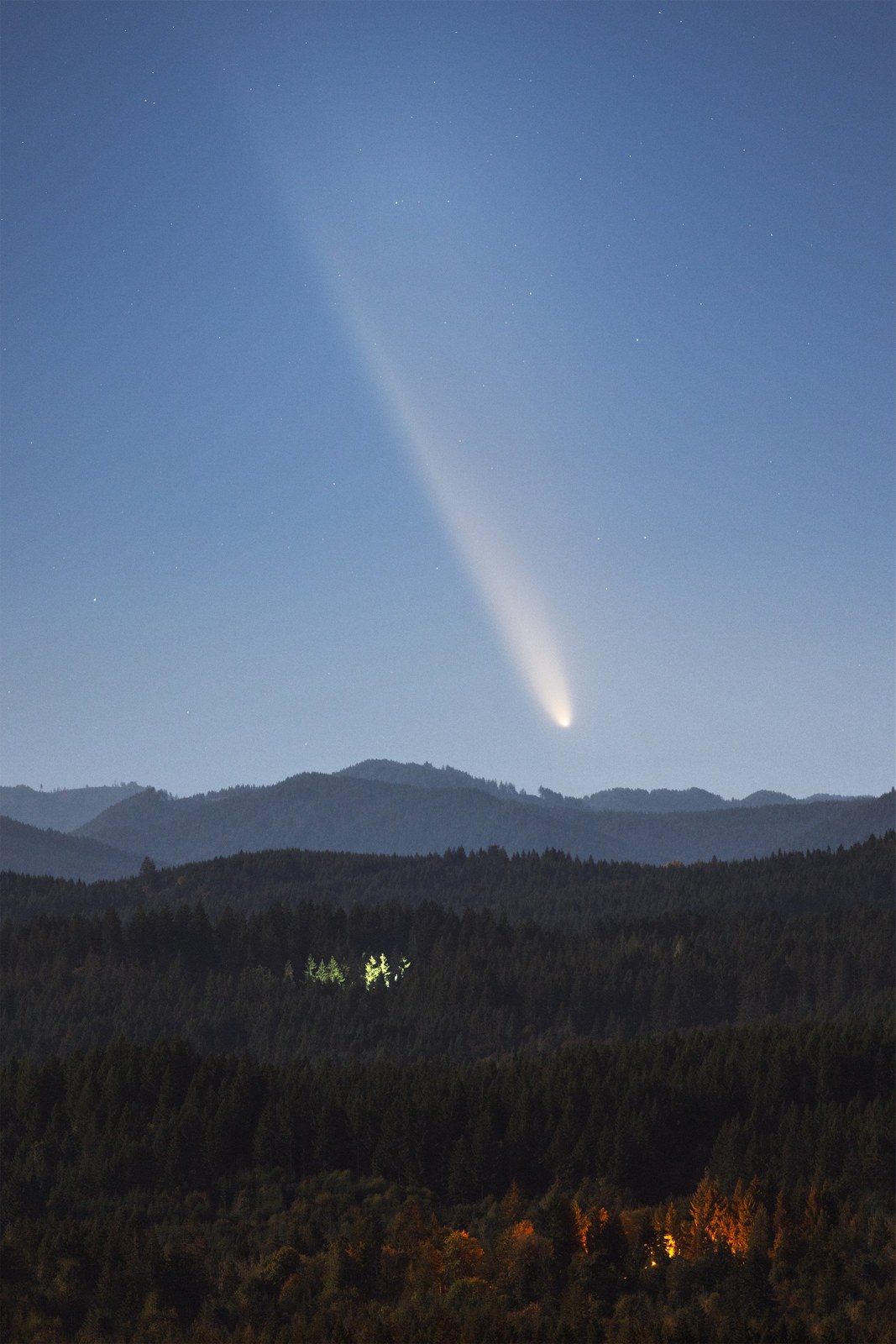 Comet tsuchinshan atlas above mountains