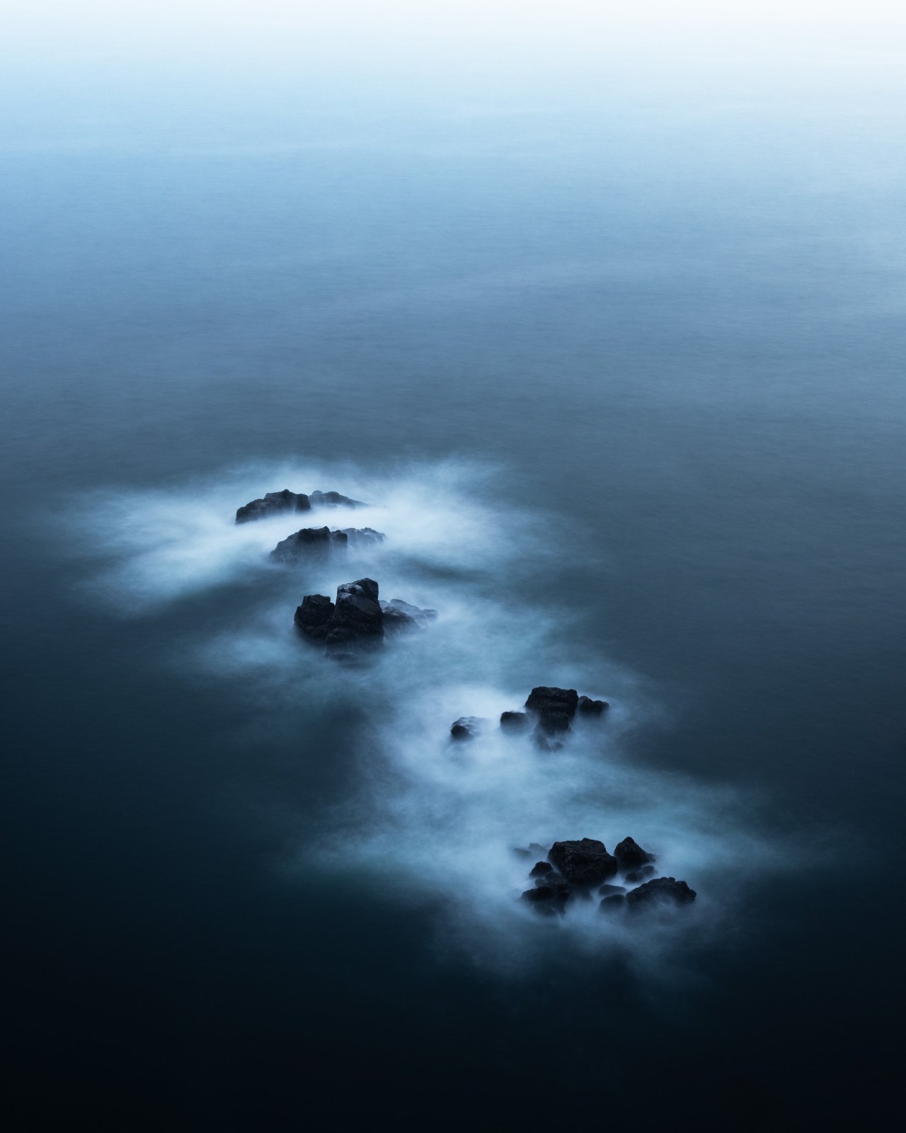 Ocean rocks in mist