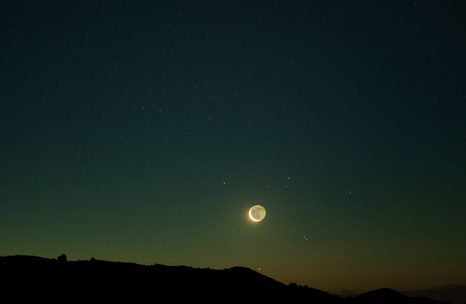 Old moon rising